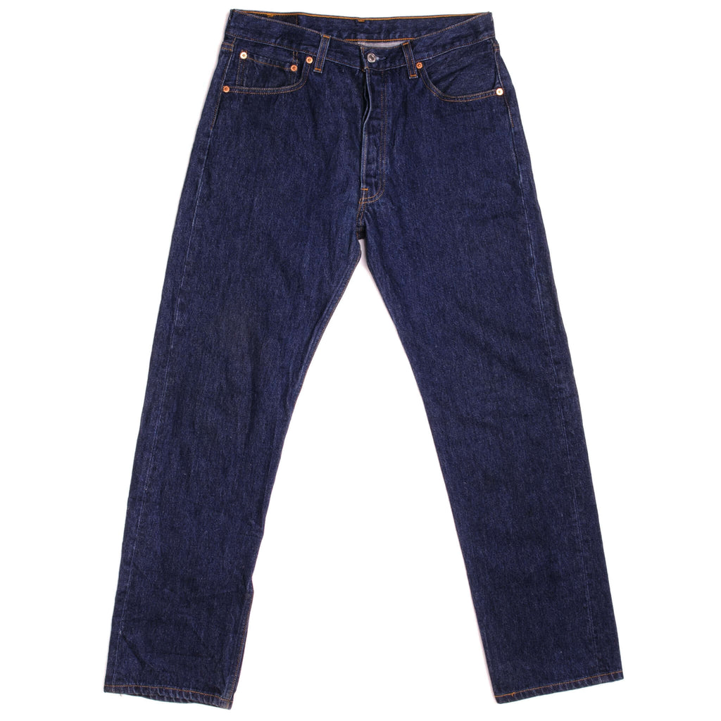 Beautiful Indigo Levis 501 Jeans Made in USA with a very dark wash.  Size on Tag 34X34  ACTUAL SIZE 33X31  Back Button #555