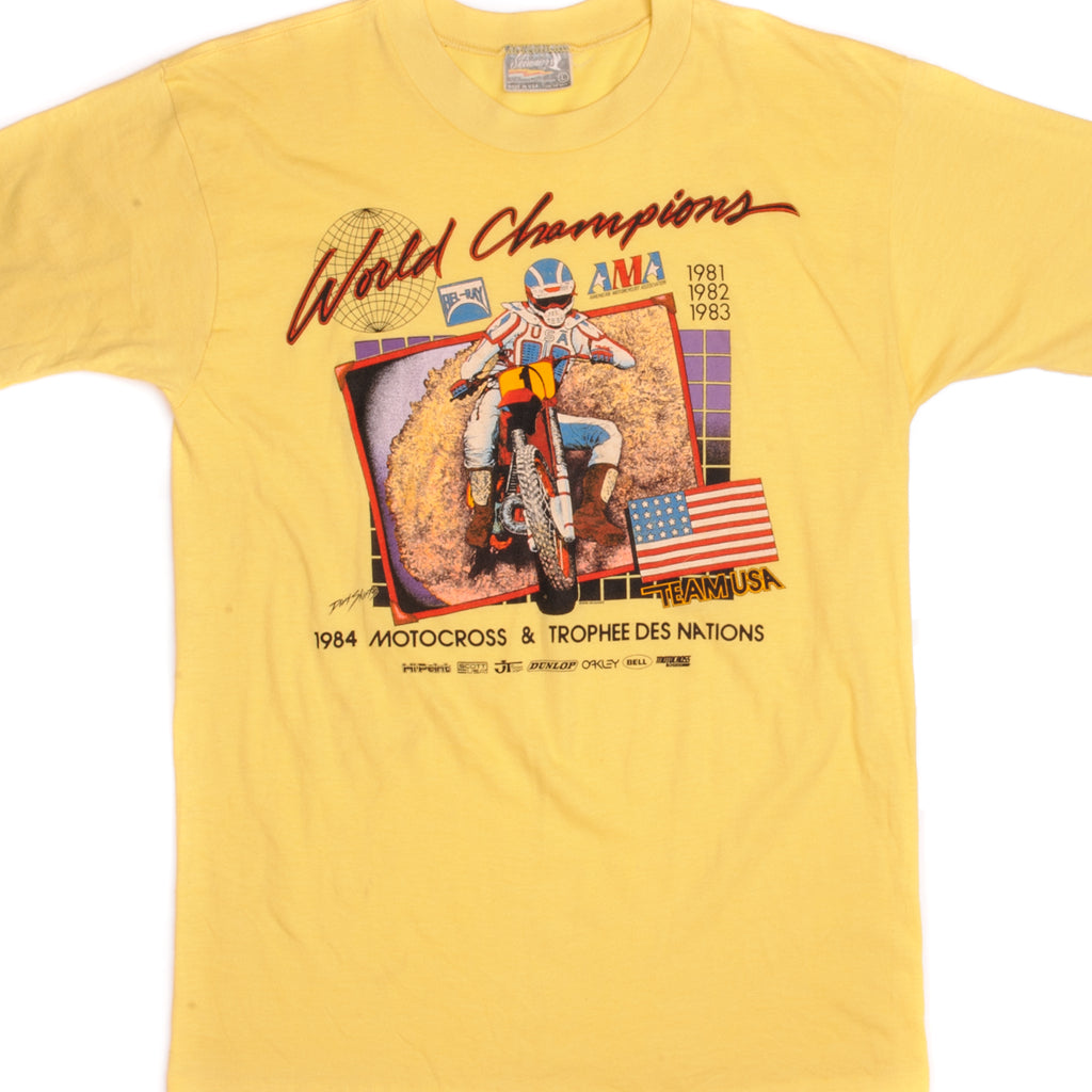 Vintage American Motorcyclist Association World Champions Motocross & Trophee Des Nations Skimmer Tee Shirt 1984 Size Medium Made In USA with single stitch sleeves.