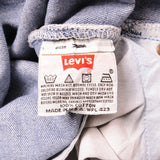 Beautiful Indigo Levis 501 Jeans 1990s Made in USA with a light blue wash and some nice light whiskers.  Size on Tag 30X32  ACTUAL SIZE 28X28  Back Button #555