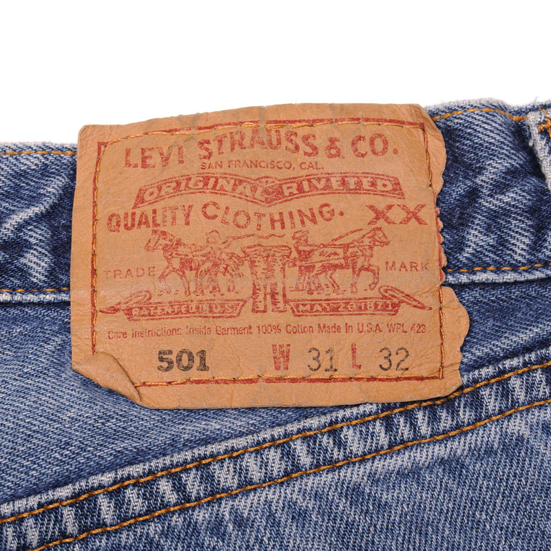 Beautiful Indigo Levis 501 Jeans 1990s Made in USA with a medium blue wash and a nice contrast of light and medium blue.  Size on Tag 31X32  ACTUAL SIZE 31X31  Back Button #544