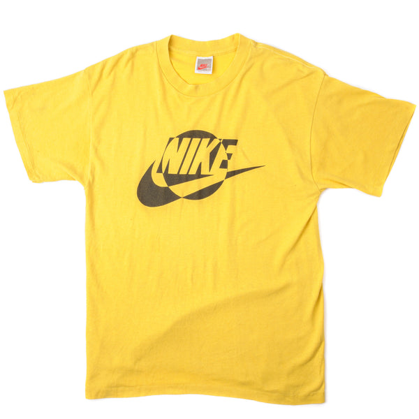 Vintage Nike Tee Shirt from 1987 to 1992 Size Medium Made In USA. yellow