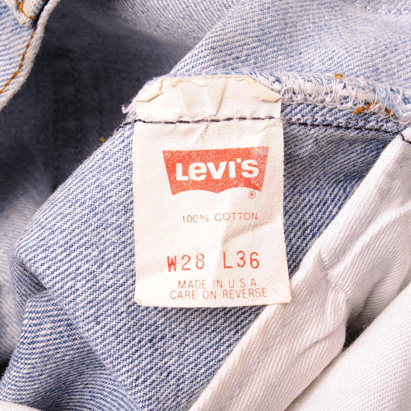 Beautiful Indigo Levis 501 Jeans Made in USA with a light blue wash and a nice contrast of light blue and very light blue.  Size on Tag 28X36  ACTUAL SIZE 27X29  Back Button #555