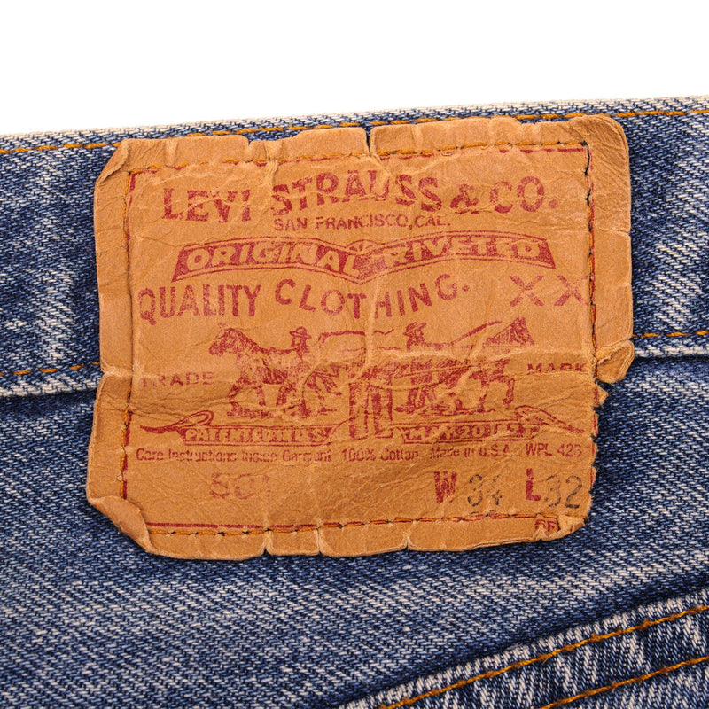 Beautiful Indigo Levis 501 Jeans 1988-1993 Made in USA with a medium blue wash, a nice contrast of light and medium blue and some light whiskers.  Size on Tag 34X32  ACTUAL SIZE 33X30  Back Button #501