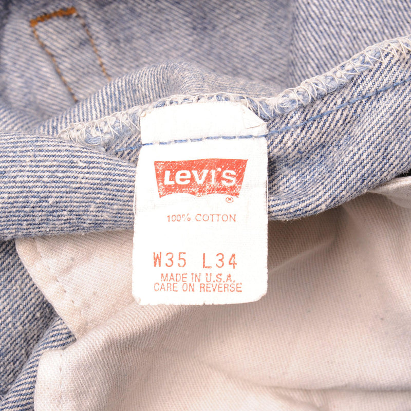 Beautiful Indigo Levis 501 Jeans 1988-1993 Made in USA with a medium blue wash, a nice contrast of light and medium blue and some strong whiskers.  Size on Tag 35X34  ACTUAL SIZE 34X30  Back Button #524