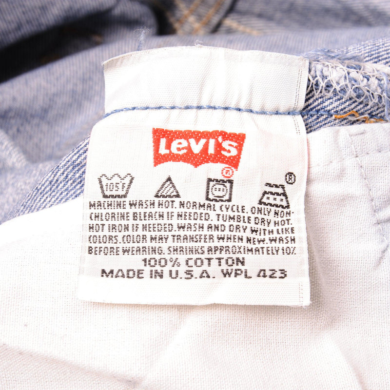 Beautiful Indigo Levis 501 Jeans 1990s Made in USA with a medium blue wash, a nice contrast of light and medium blue and some strong whiskers.  Size on Tag 35X38  ACTUAL SIZE 34X34  Back Button #524