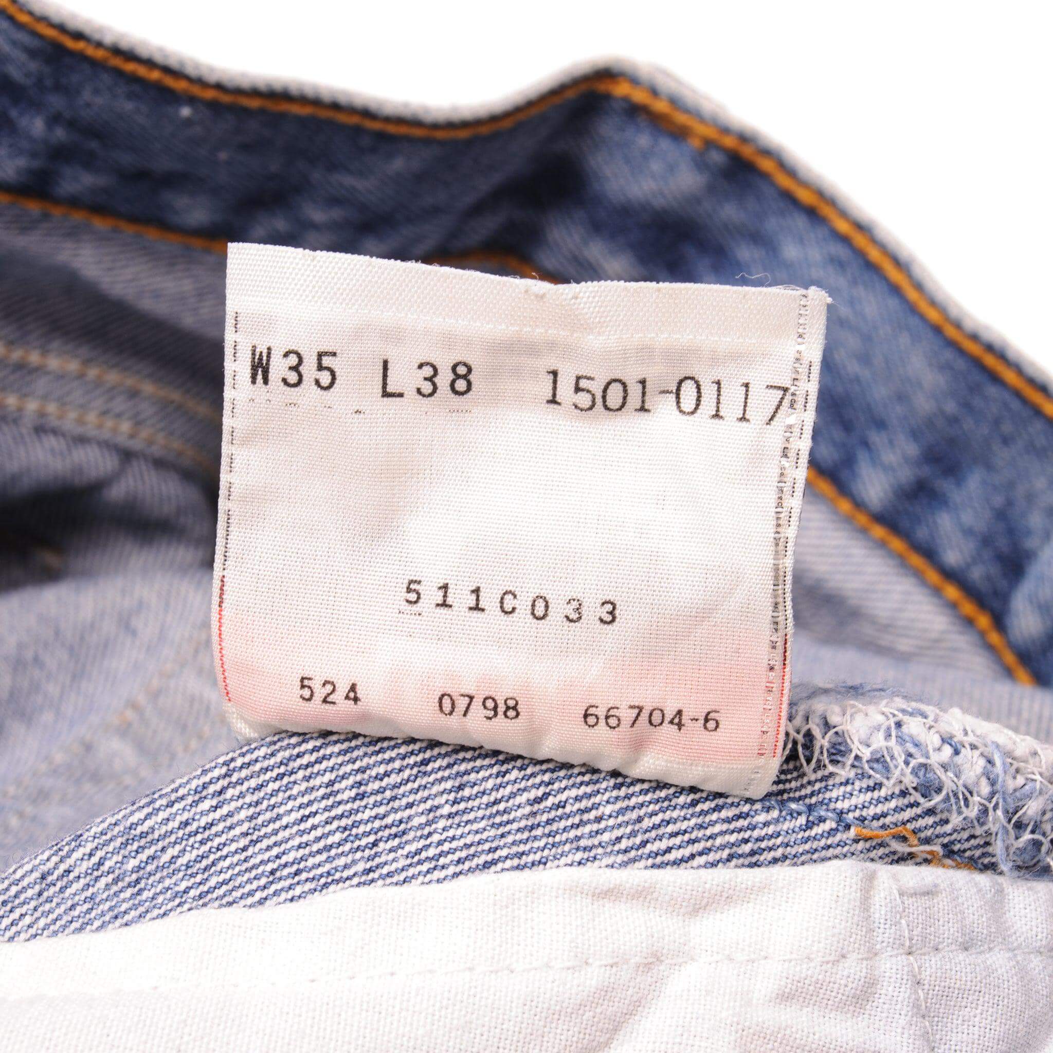 Beautiful Indigo Levis 501 Jeans 1990s Made in USA with a medium blue wash, a nice contrast of light and medium blue and some strong whiskers.  Size on Tag 35X38  ACTUAL SIZE 34X34  Back Button #524