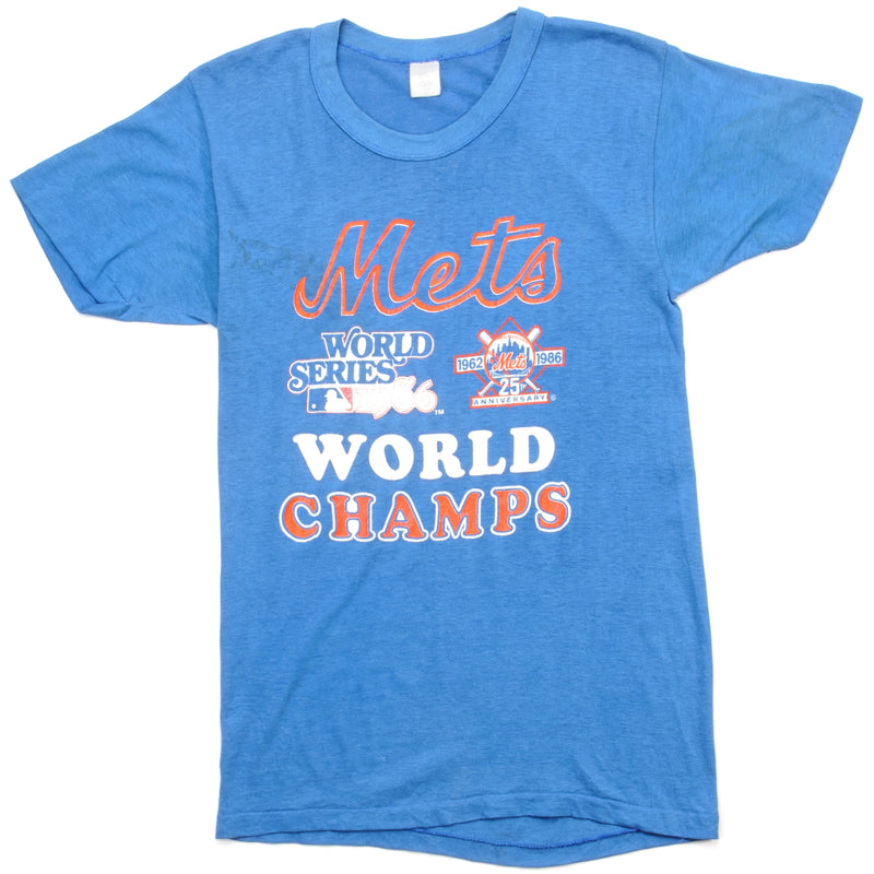 Vintage MLB New York Mets World Champs World Series 1986 Tee Shirt Size XS Made In USA With Single Stitch Sleeves. BLUE