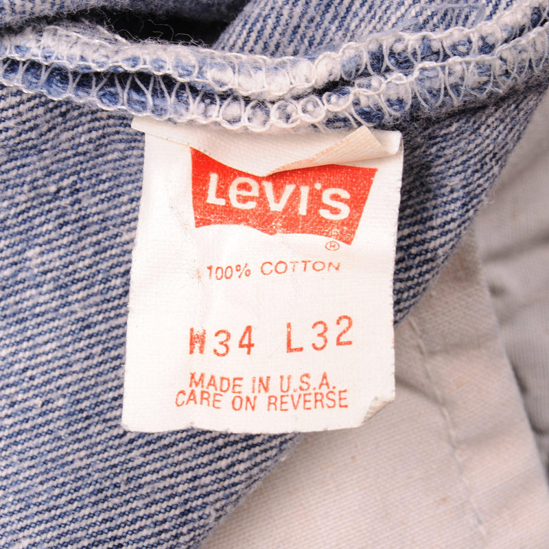 Beautiful Indigo Levis 501 Jeans Made in USA with a medium blue wash, some nice contrast between light and medium blue and some light whiskers.  Size on Tag 34X32  ACTUAL SIZE 32X28  Back Button #546