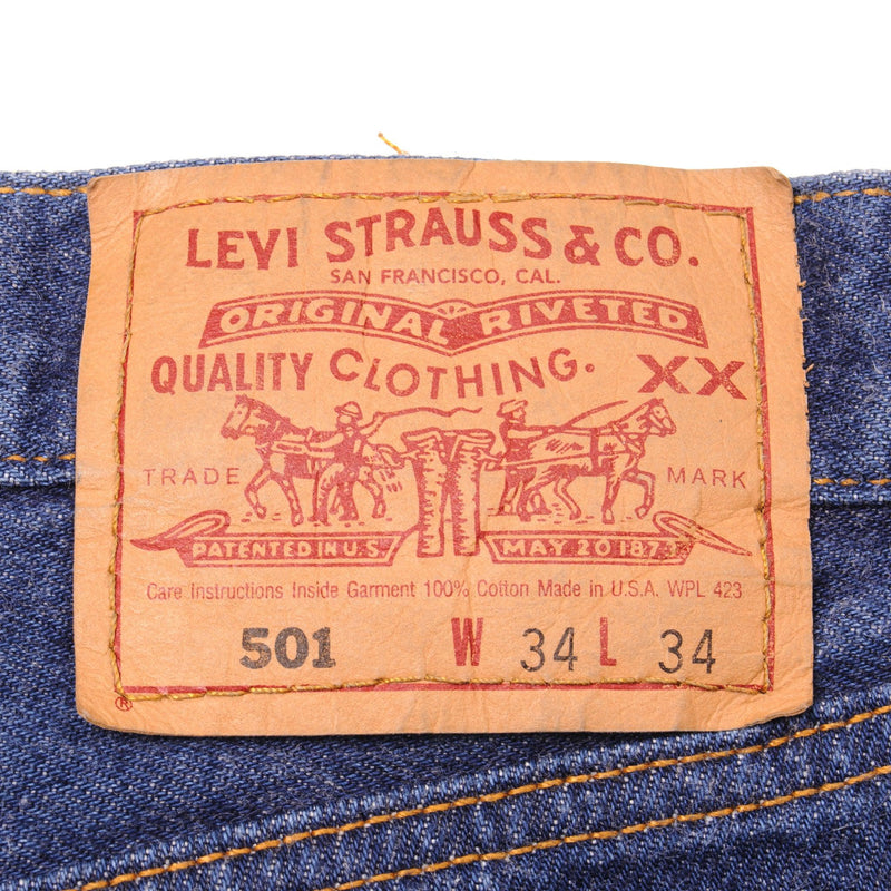 Beautiful Indigo Levis 501 Jeans 1990's Made in USA with a very dark wash.  Size on Tag 34X34  ACTUAL SIZE 33X34  Back Button #544