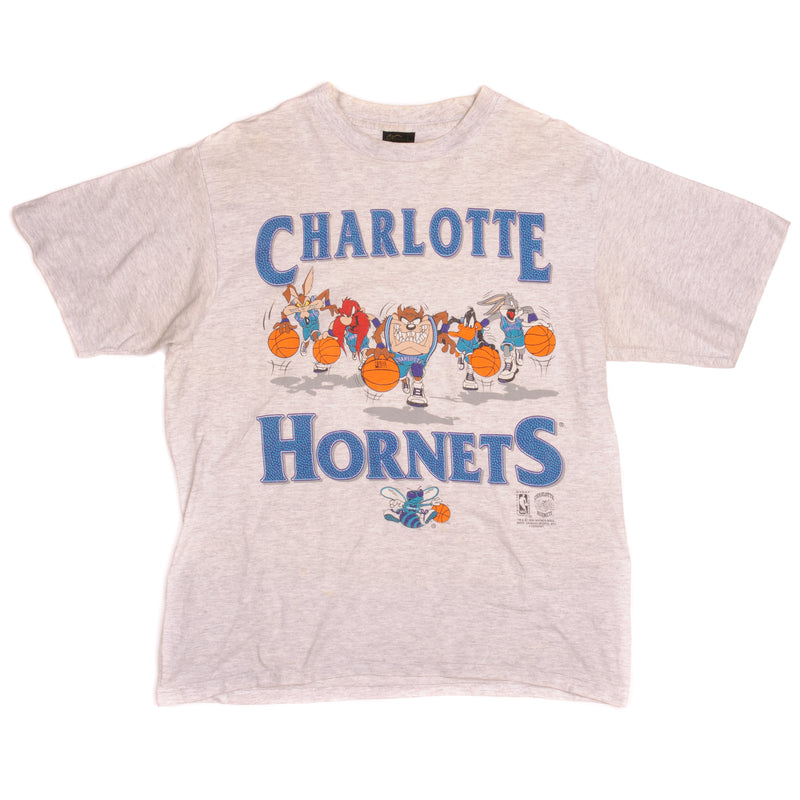 Vintage NBA Looney Tunes Charlotte Hornets With Wile E. Coyote, Yosemite Sam, Taz, Daffy Duck, Bugs Bunny Changes Tee Shirt 1994 Size XL Made In USA With Single Stitch Sleeves.