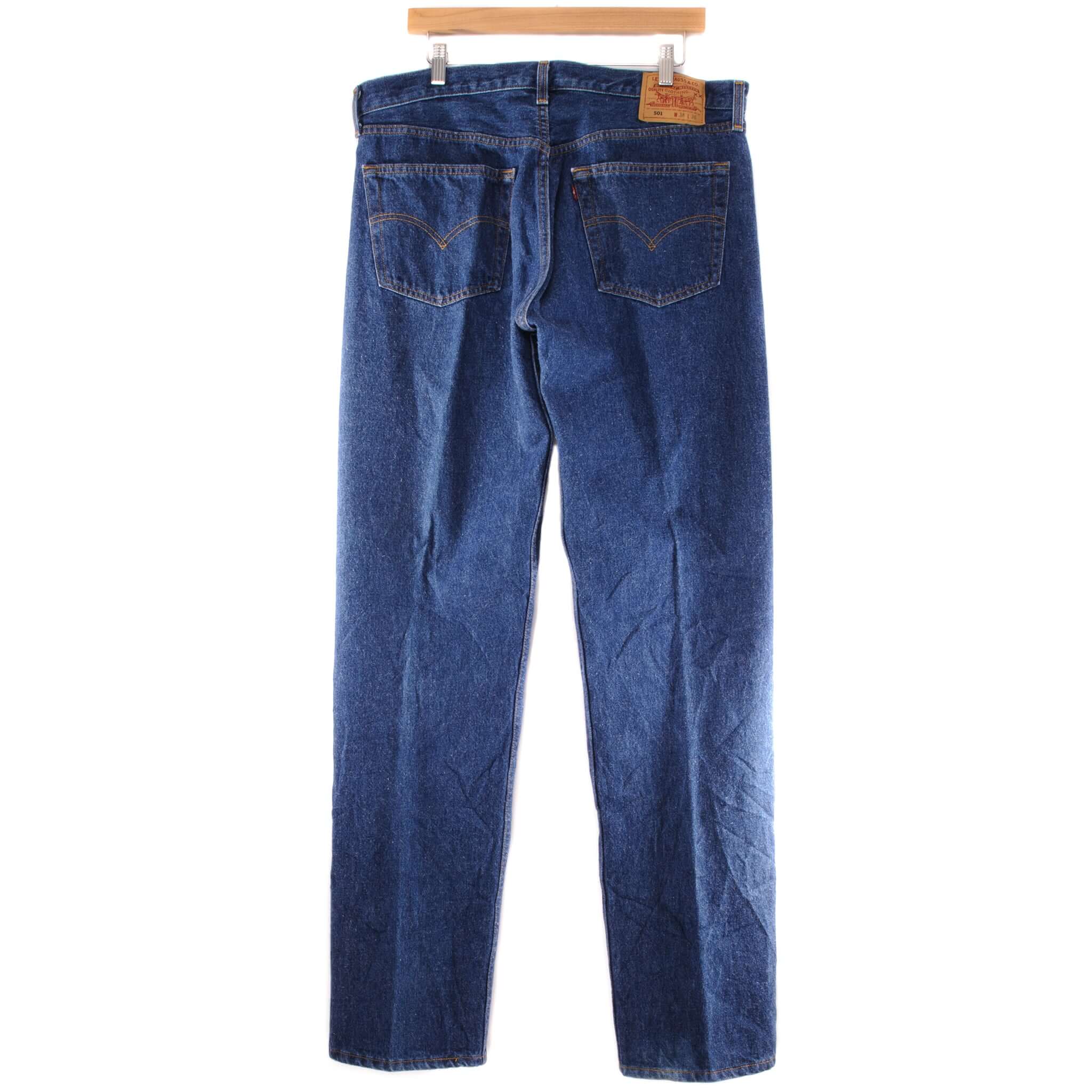 Beautiful Indigo Levis 501 Jeans 90s Made in USA with a dark wash.  Size 37x36  Back Button #524M