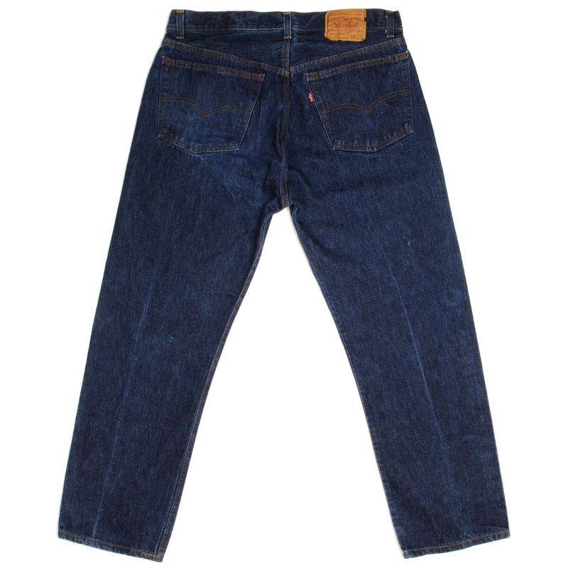 Beautiful Indigo Levis 501 Jeans Early 1980s Made in USA with a dark wash and some nice contrast between dark and medium wash.  Size on Tag 38X32  ACTUAL SIZE 35X28  Back Button No Number